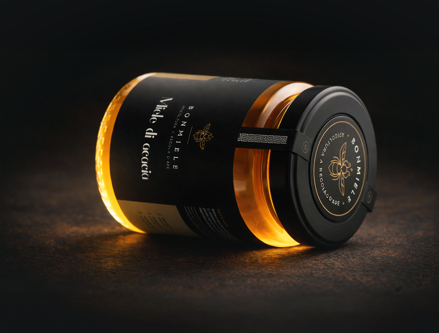 Bonmiele acacia honey jar with black luxury label photographed on dark surface