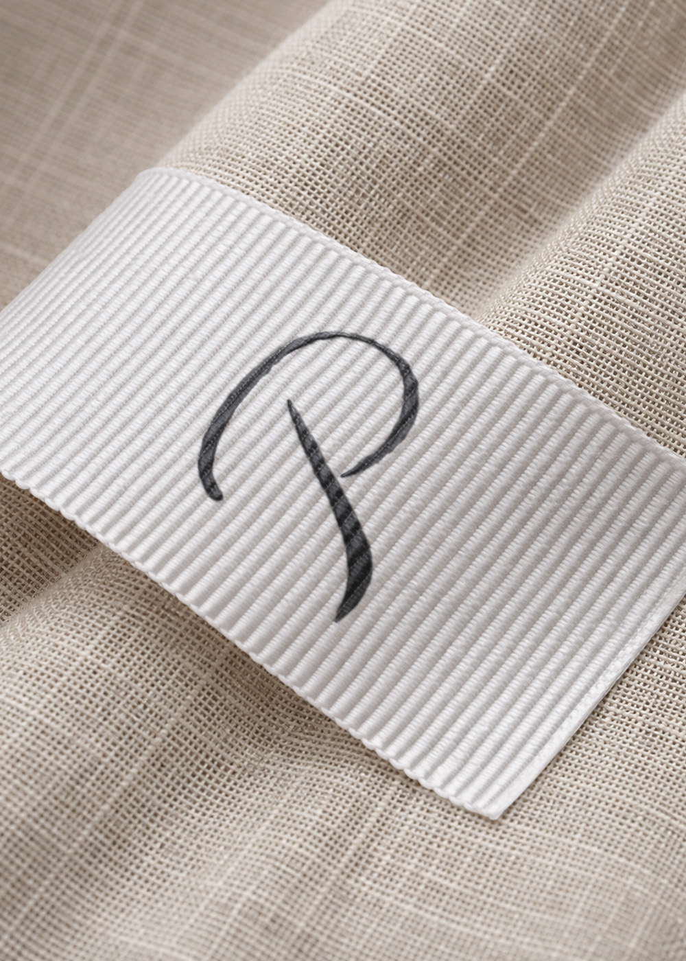 Primolino P monogram.