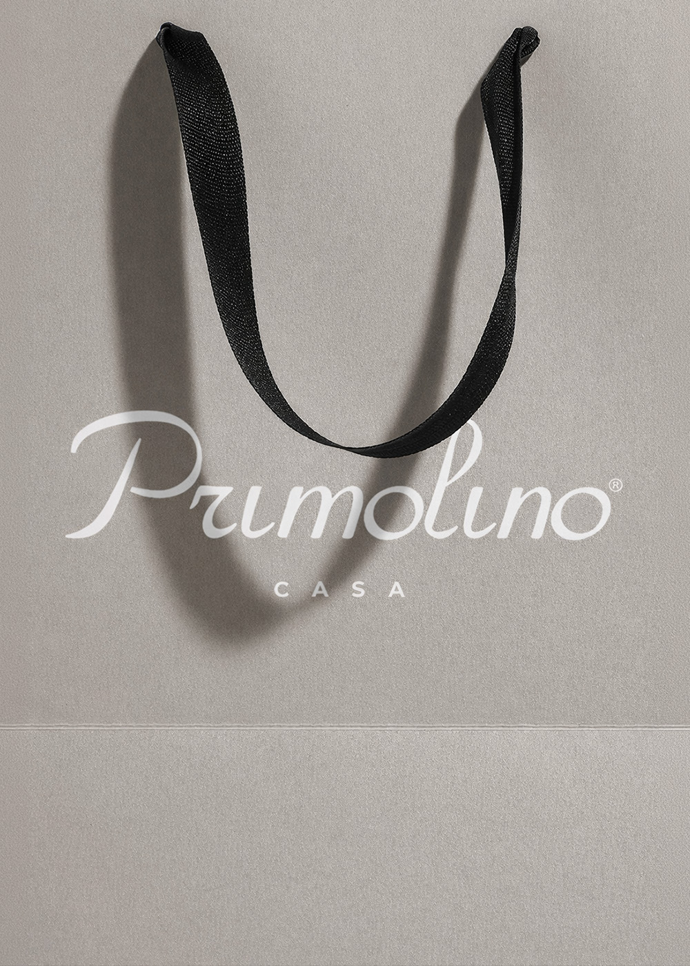 Primolino Casa shopping bag with monogram branding.