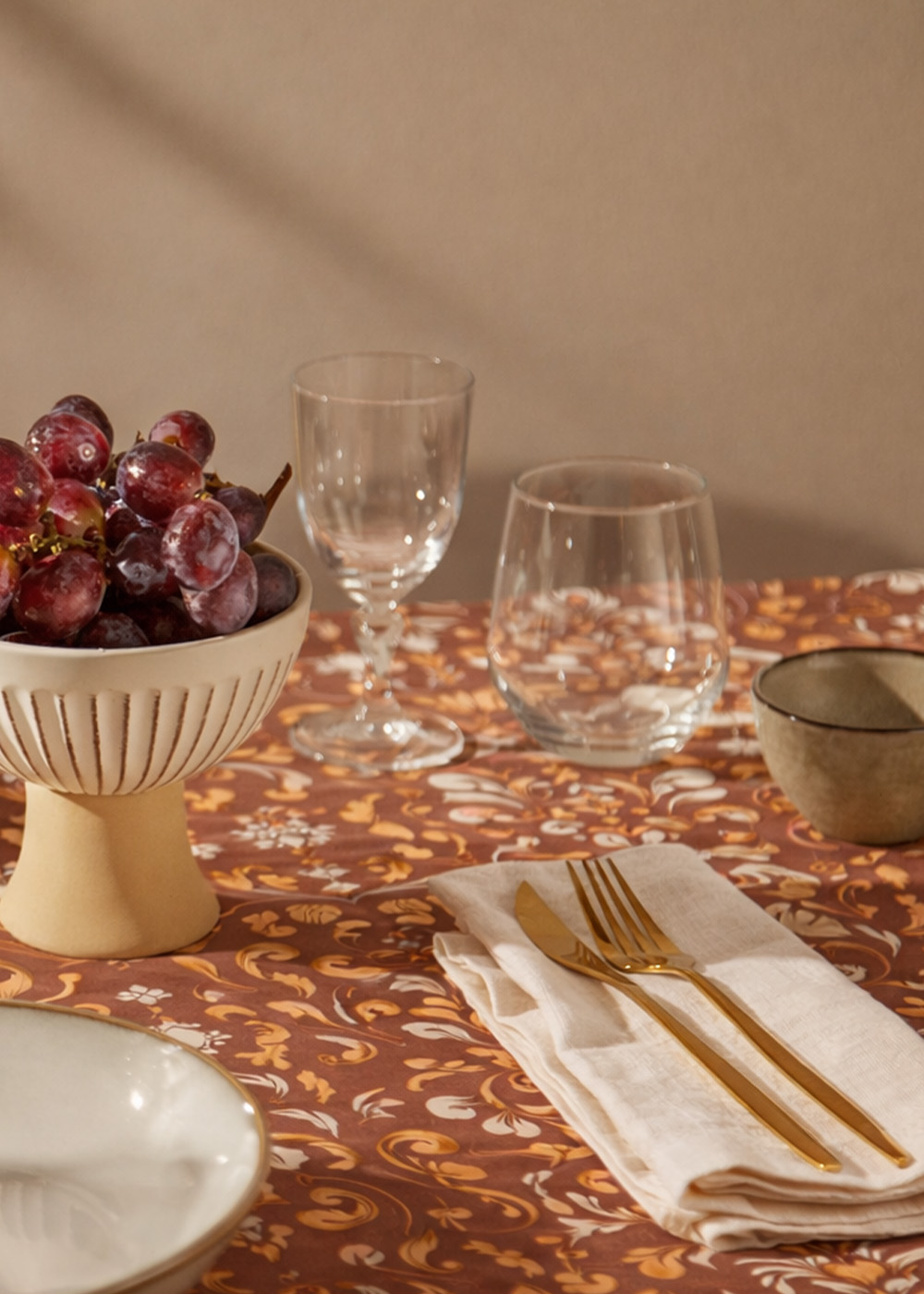 Heraldic pattern in earth-toned palette.